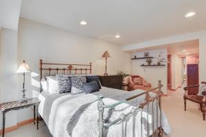 a bedroom with a bed and a chair at Condo Near Golf Club about 2 Mi to Vail Ski Resort! in Vail