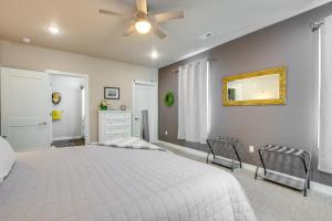 a bedroom with a bed and a ceiling fan at Modern South Pier Condo on Sheboygan River! in Sheboygan