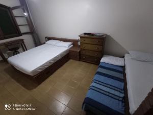 Posteľ alebo postele v izbe v ubytovaní Apartamento com piscina no Lázaro