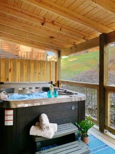 a outdoor shower with a sink in a deck at Tsaliwood Cabin in Sevierville