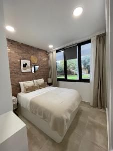 Postel nebo postele na pokoji v ubytování Casa Alberto - Eurosol Bajo 10 - Carihuela
