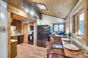 a kitchen with a table and chairs in a house at Riverside Colorado Chalet with Deck and Hot Tub in Dumont