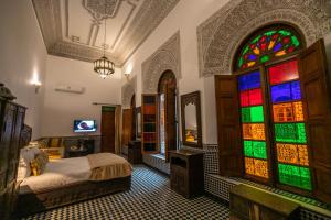 Postel nebo postele na pokoji v ubytování Riad La Perle De La Médina