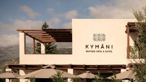 a sign for kyrmani private hotel and suites at KYMANI Boutique Hotel & Suites in Plakias