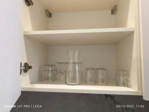 a row of glass jars sitting on a shelf at LE PANORAMIQUE in Nice