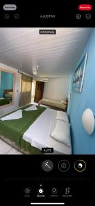 Ένα ή περισσότερα κρεβάτια σε δωμάτιο στο Pousada Elpirata Sidney
