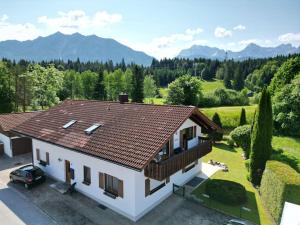 an aerial view of a house with a roof at Alpenblick am Barmsee / FeWo Viola in Krün