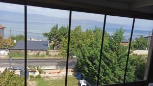 a view of the ocean from a house window at Gölyaka Hotel in Bursa