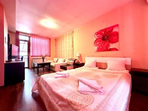 Postel nebo postele na pokoji v ubytování Family Hotel Carpe Diem