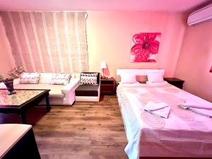 Postel nebo postele na pokoji v ubytování Family Hotel Carpe Diem