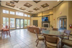 a large living room with a table and chairs at Modern 2BR Oasis Pool, Gym & Parking Near Airport in Phoenix