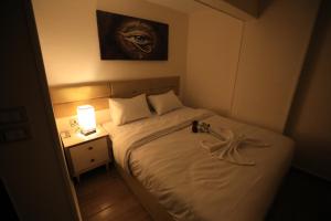 Voodi või voodid majutusasutuse Pyramids Heart Hotel toas