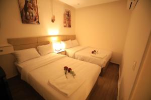 Voodi või voodid majutusasutuse Pyramids Heart Hotel toas