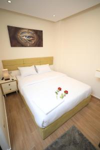 Voodi või voodid majutusasutuse Pyramids Heart Hotel toas