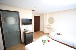 Voodi või voodid majutusasutuse Pyramids Heart Hotel toas