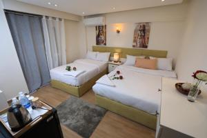Voodi või voodid majutusasutuse Pyramids Heart Hotel toas