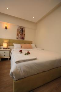 Voodi või voodid majutusasutuse Pyramids Heart Hotel toas