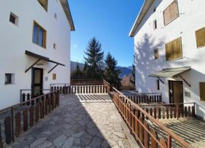 an external view of a building with a wooden fence at Amy House in San Giacomo