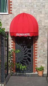 a red awning over the door of a hotel at Gölyaka Hotel in Bursa