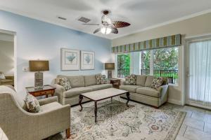 a living room with two couches and a table at Comfort and Style at AIP Resort in Amelia Island