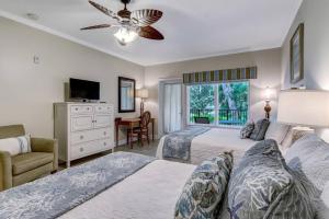 Giường trong phòng chung tại Comfort and Style at AIP Resort +55 ảnh