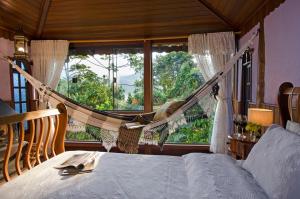 En eller flere senge i et værelse på Aldebaran Pousada + 161 billeder