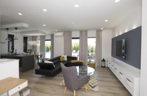 a living room with a couch and a table at Holiday Home EB with Heated Pool in Gata