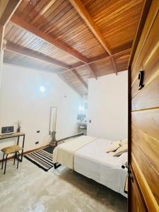 Voodi või voodid majutusasutuse Calipso Ocean Lodge- Avellana Beach Hotel toas