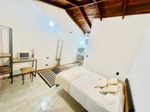 Voodi või voodid majutusasutuse Calipso Ocean Lodge- Avellana Beach Hotel toas