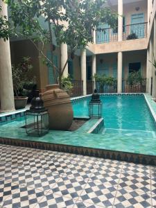 a swimming pool in the middle of a building at Hotel Riad Taroudant in Taroudant