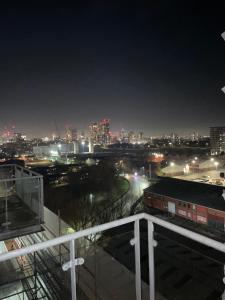 a view of a city at night with lights at Manchester Old Trafford CityView En-Suite Apt in Manchester