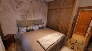 a bedroom with a bed in a room at Le Case Nel Bosco Terminillo in Terminillo +74 photos