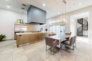 a kitchen and dining room with a table and chairs at Starry Waters Retreat in Sarasota