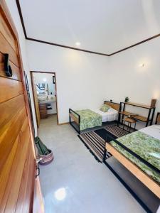 Voodi või voodid majutusasutuse Calipso Ocean Lodge- Avellana Beach Hotel toas
