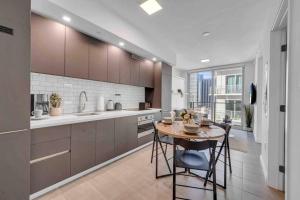 a kitchen with a table and a counter top at Breathtaking studio in the Heart Miami in Miami
