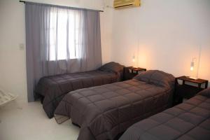 Katil atau katil-katil dalam bilik di Casa Aconchego