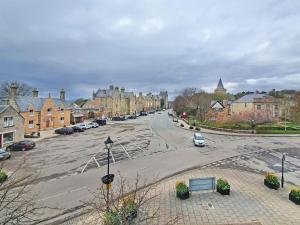 an empty street in a town with houses at Argyle Place in Dornoch