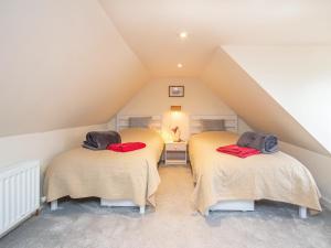 מיטה או מיטות בחדר ב-Islas Cottage