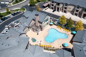 an aerial view of a pool at a resort at Steam in the year round hot tub after a Ski trip in South Jordan