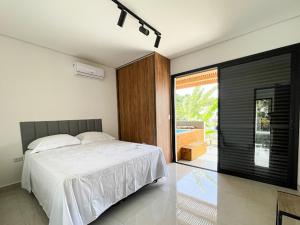 Postel nebo postele na pokoji v ubytování Home Aguas da barra Ilhabela