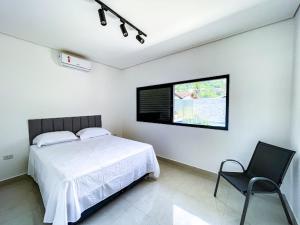 Postel nebo postele na pokoji v ubytování Home Aguas da barra Ilhabela + 53 fotografií