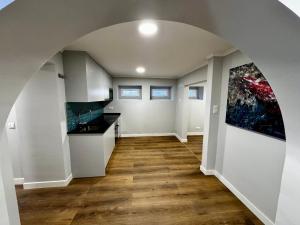 a hallway of a home with a kitchen and an archway at Relax and Explore Lisbon Suites and Rooms in Lisbon
