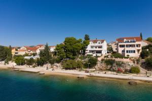 a view of a beach with houses and condos at Apartments by the sea Brodarica, Sibenik - 466 in Brodarica