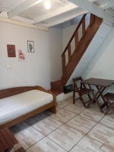 Cama o camas de una habitación en CHALÉS ARCO ÍRIS - Para quem procura simplicidade e uma excelente localização