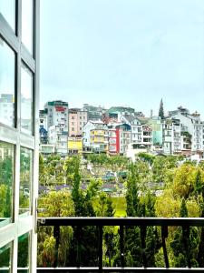 a view of a city from a window at Phuong Vy Hotel in Da Lat
