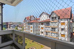 a view of a group of buildings from a balcony at Morada da Montanha 2 dorm by Achei Gramado in Gramado