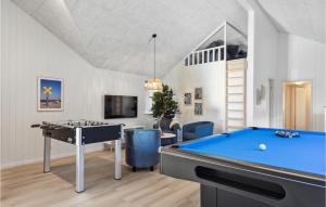a living room with a pool table and a tv at Aqua 242 in Charlottenthal