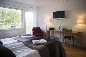 Letto o letti in una camera di Toftastrand Hotell