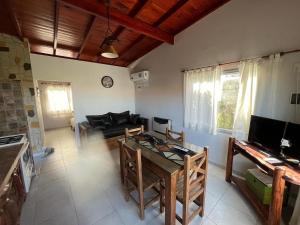 a living room with a couch and a table at Ayres de Cobo in Mar de Cobo