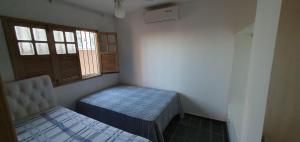 Postel nebo postele na pokoji v ubytování Casa Sol&Mar com Piscina na Beira da Praia Guriri
